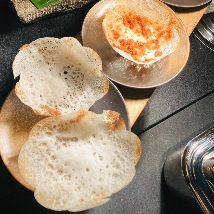 Hoppers being served at a restaurant